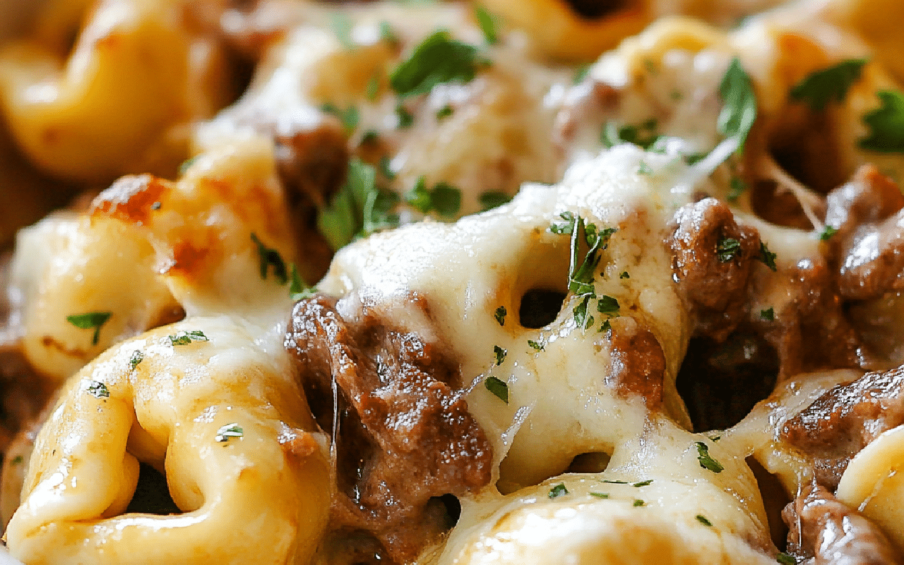cheesy cheesesteak tortellini combines steak, peppers, and pasta in one hearty skillet dish